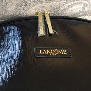Lancôme black shiny makeup case.